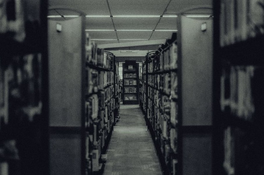 Stack of paper archive files being prepared for digital scanning